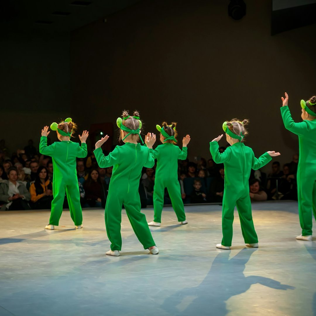 Young performers take the spotlight Children performing on stage