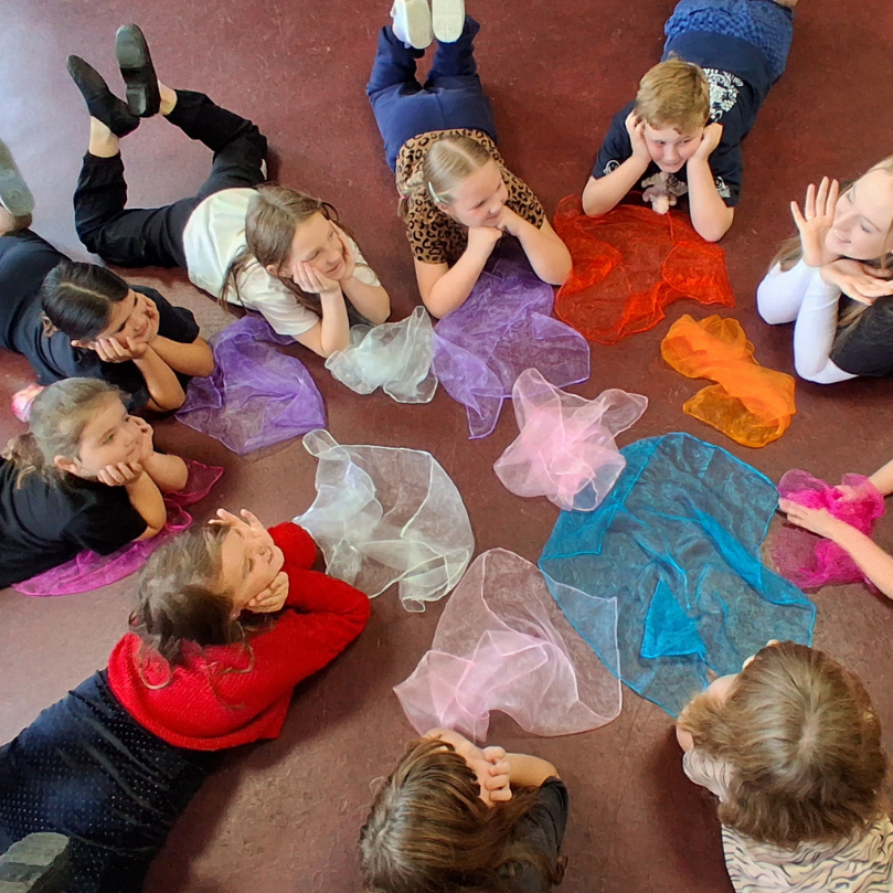 Children performing on stage 
